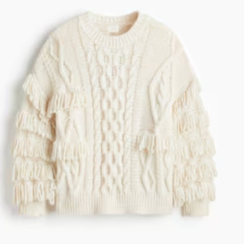 Long Sleeve Sweater with fringe.